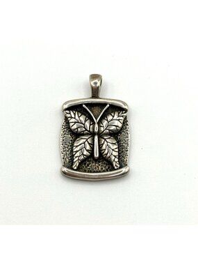 Vintage Sterling Silver Butterfly Pendant Textured Background
